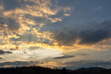 Beautiful clouds at sunset over the mountains. Nature.