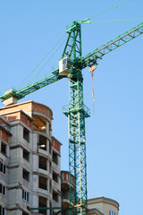 Construction site background. Crane near building.