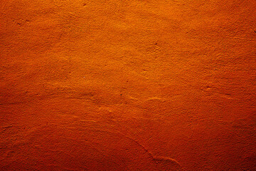 Orange colored abstract wall background with textures of different shades of orange