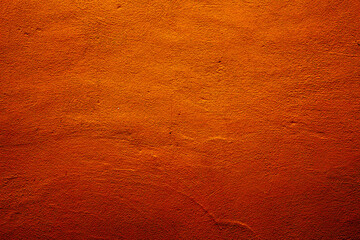 Orange colored abstract wall background with textures of different shades of orange