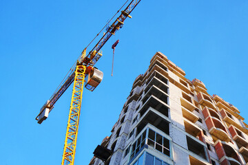 Construction site background. Crane near building. Industrial background.