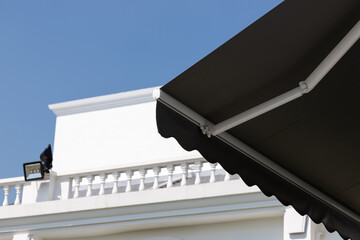 new black awning of building. black canvas roof.