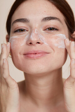 Cute Woman Hydrating Skin Closeup