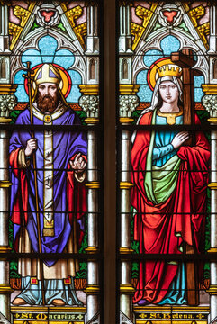 VIENNA, AUSTIRA - OCTOBER 22, 2020:  The St. Macarius and St. Helena on the stained glass in the Laurentiuskirche by workrooms from Czech and Austria (end of 19. cent.).