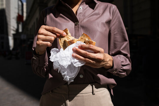 A Woman Eating Bagel