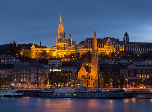 The Fisherman's Bastion with evening lights turning on.
