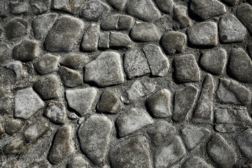 old stone pavement background / abstract pavement, large cobblestones, old road texture