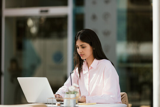 Brunette woman drinking coffee in her morning break
