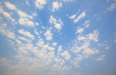 Bright blue sky full of white clouds