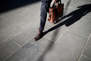 Man walking to work carrying a briefcase