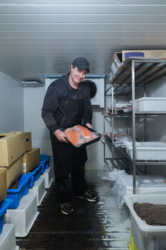 Fishmonger in store coolroom