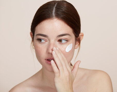 Sensitive Skin Hydration - Young cute woman portrait - Natural Freckles