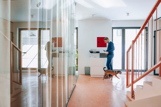 Young Businessman Using Copier