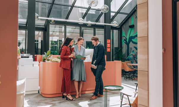 Group of Elegant Modern Businesspeople Working Together
