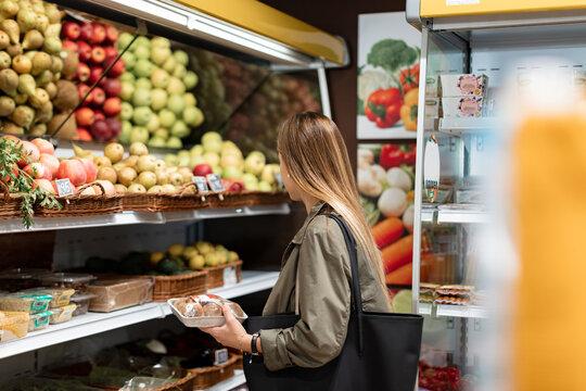 Woman making purchase in an ecological store