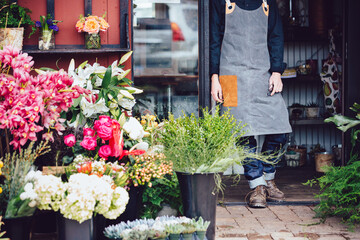 Flower shop owner in storefront