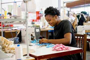 African woman sewing in a workshop