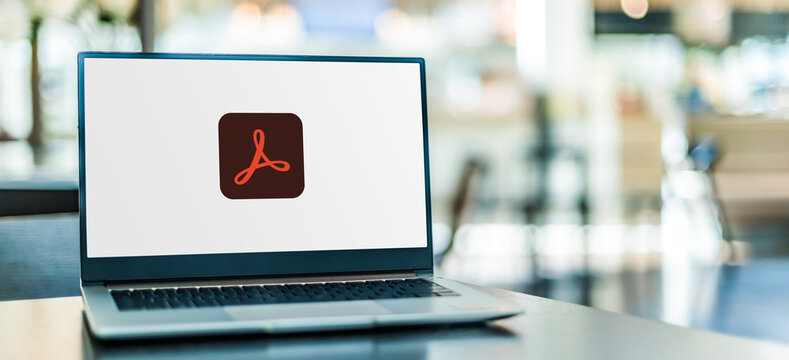 Laptop computer displaying logo of Adobe Acrobat Professional