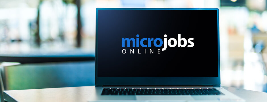 Laptop computer displaying the sign "micro jobs online"