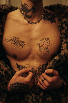 Anonymous Tattooed Man Wearing Faux Fur Coat