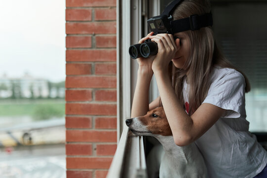 Girl watching from the window.