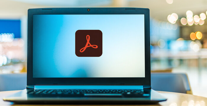 Laptop computer displaying logo of Adobe Acrobat Professional