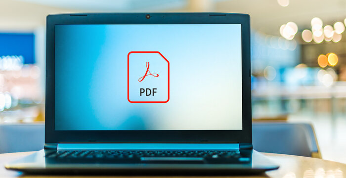 Laptop computer displaying logo of Adobe Acrobat file