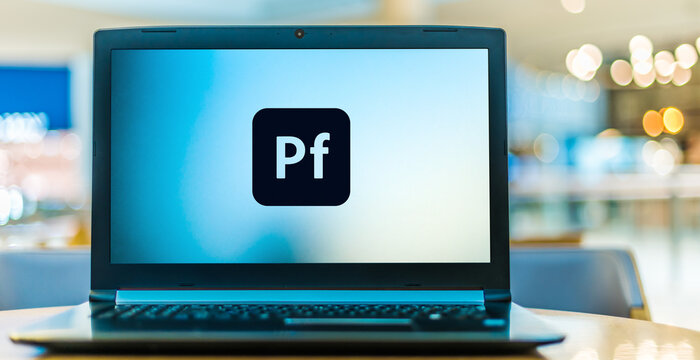 Laptop computer displaying logo of Adobe Portfolio