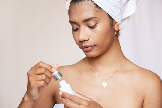 Young woman using beauty product