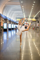 Girl ballerina at the airport. Ballerina dancing
