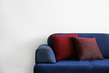 Cropped shot of colorful couch and cushions in waiting room. Close up, copy space, background.