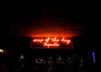 Neon sign in a bar.