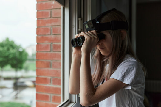 Girl watching from the window.