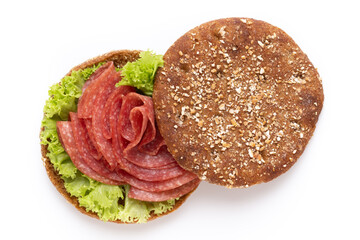 Sandwich with salami sausage on white background.
