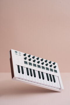 Midi Keyboards On Pastel Background