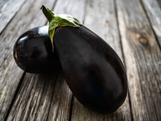Ripe aubergine on wooden table