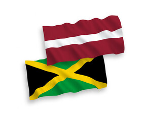 National vector fabric wave flags of Latvia and Jamaica isolated on white background. 1 to 2 proportion.