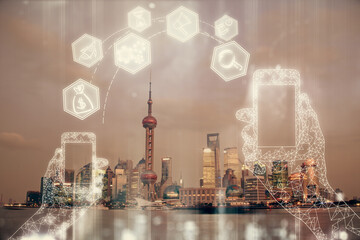 Double exposure of technology theme hologram and cityscape background. Concept of Hightech.