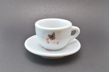 Obraz premium White mug with drawings on a dark background