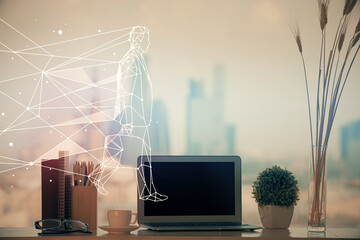 Desktop computer background in office and start up theme hologram drawing. Double exposure. Startup...