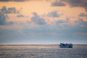 Floating ship and beautiful sunset over the Black Sea