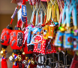 Collection of colorful souvenirs hanged at a shop in Tokyo, Japan.
