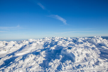 Fototapeta na wymiar Closeup of frozen snow in heavy winter. details.