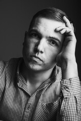 Handsome young guy looking sad full face
