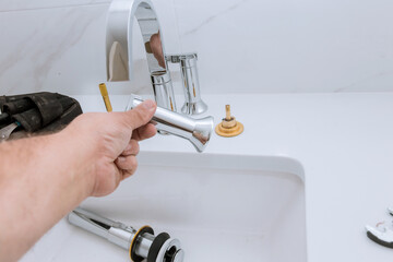 Plumbing assemble faucet of a sink plumber tools equipment in a bathroom