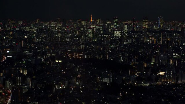 TOKYO, JAPAN : Aerial high angle sunrise CITYSCAPE of TOKYO. View of office buildings around Shinjuku and Minato ward. Japanese urban metropolis concept. Time lapse zoom in shot night to morning.