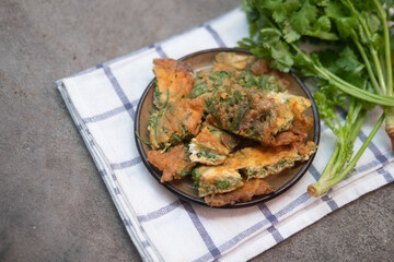 Omelet with Climbing Wattle. Traditional Thai style food