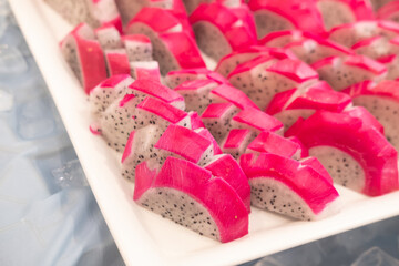 Sliced dragon fruits on plate in buffet at hotel
