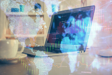 Financial graph colorful drawing and table with computer on background. Double exposure. Concept of...