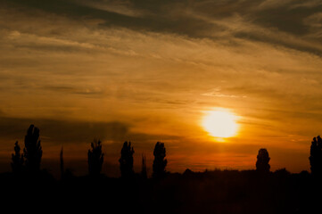 Fototapeta na wymiar nice landscape in the evening warm sun, with dramatic clouds
